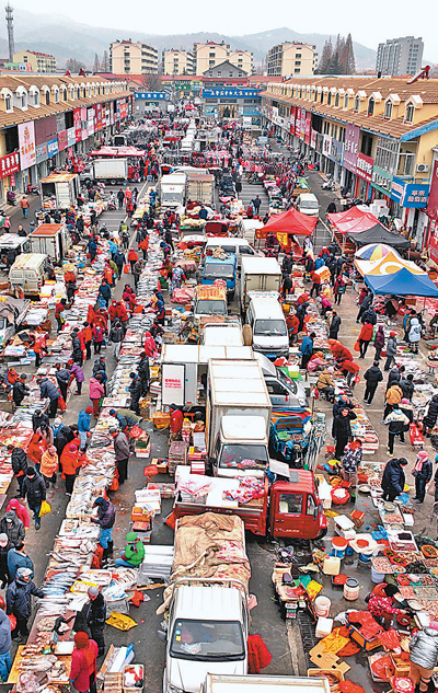 年货市场购销两旺(新时代画卷)